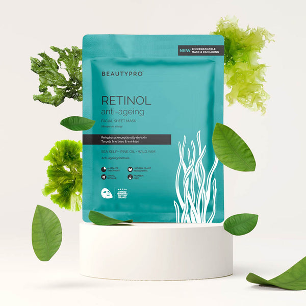 An anti-ageing face mask pouch surrounded by leaves