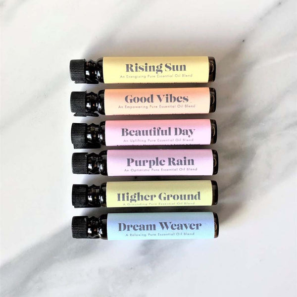 Six bottles of essential oil blend for aromatherapy jewellery, with colourful labels