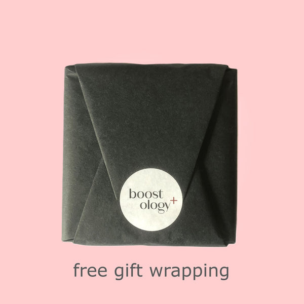 Black tissue gift wrap with a white boostology sticker