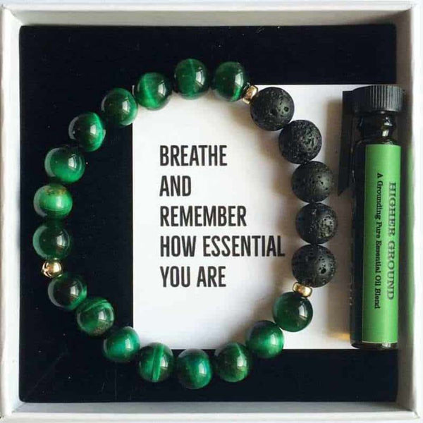 A gift box showing the beaded bracelet and a bottle of essential oil inside