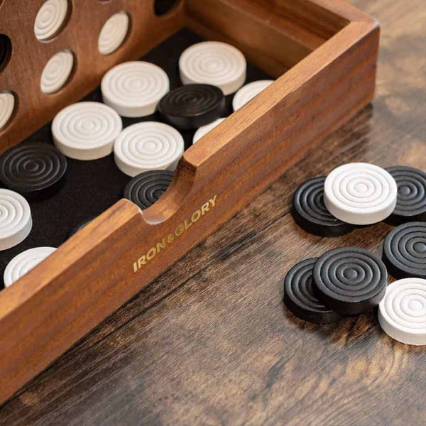 A Line Up connect 4 game with counters spilling onto a table