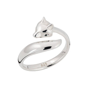 A silver fox ring on a white background