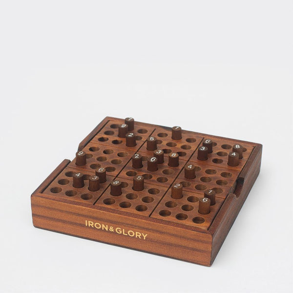 A Sudoku box with wooden pieces set into the top