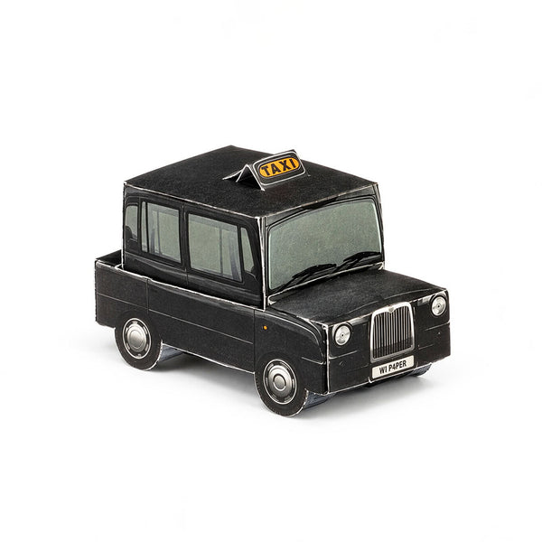 A black London taxi made from paper