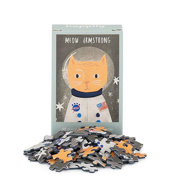 Jigsaw box with a cat in an astronaut suit design, featuring puzzle pieces on a white background.