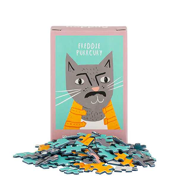 A puzzle box with jigsaw pieces underneath
