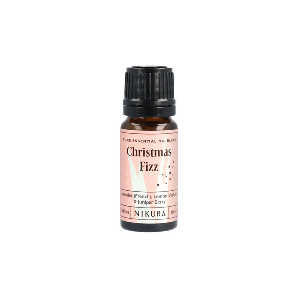 An amber glass bottle and a pink label with the words "Christmas Fizz"