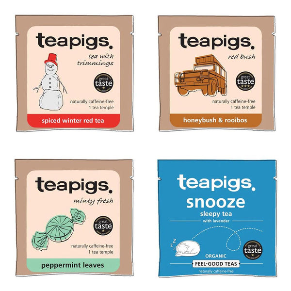 Four packages of teapigs tea with different designs, including a Christmas tea, on a white background.