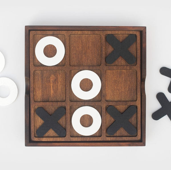 A noughts and crosses set with the playing pieces
