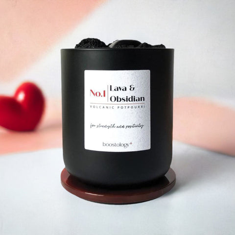 A volcanic potpourri essential oil diffuser with a red heart in the background