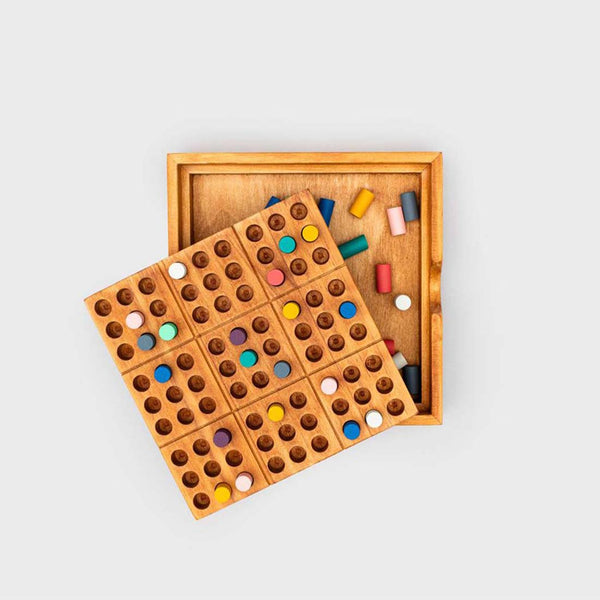 Coloured wooden pegs inserted into the top of the peace of mind game