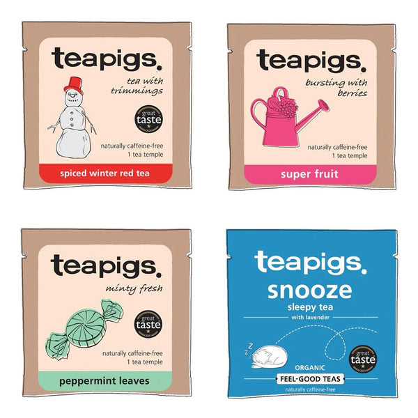 Four teapigs tea packages with different designs, including a Christmas flavour, on a white background.