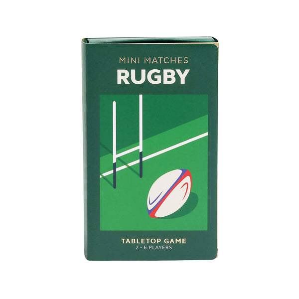 A dark green rectangular box for a tabletop rugby game, featuring a green rugby field graphic with a white post and white rugby ball with red and blue stripes. The box reads 'MINI MATCHES RUGBY' and 'TABLETOP GAME 2-6 PLAYERS'.