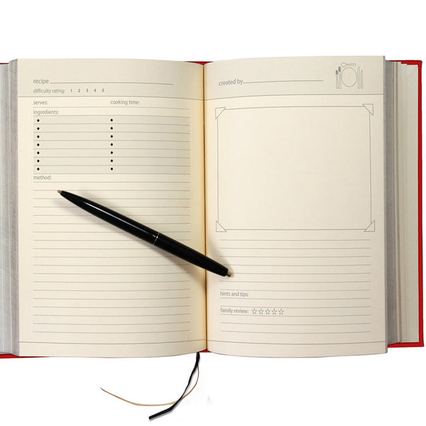 Open notebook with a pen on a white background
