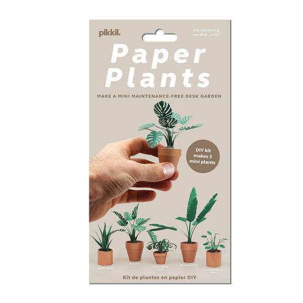 Pikkii paper plants packaging showing a hand holding a plant, on a beige background