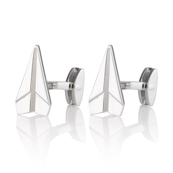 Two Silver paper plane cufflinks on a white background