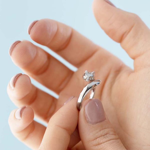 A woman holding a sterling silver fox ring