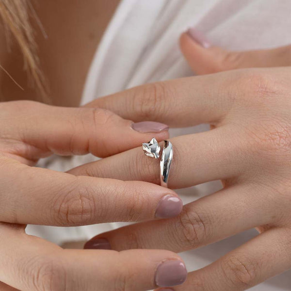 A woman wearing a silver fox ring