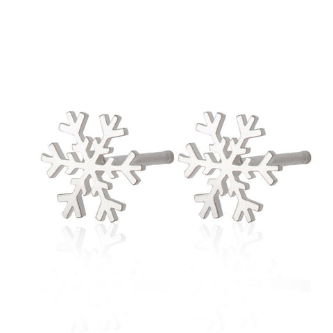 Two sterling silver snowflake earings on a white background