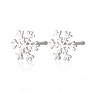 Two sterling silver snowflake earrings on a white background