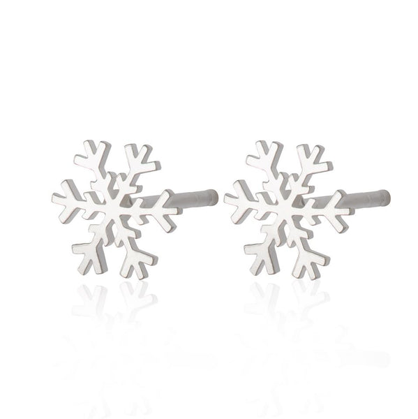 Two sterling silver snowflake earrings on a white background