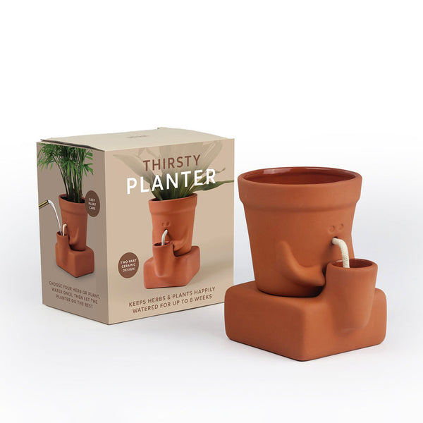 Thirsty planter next to its packaging on a white background.