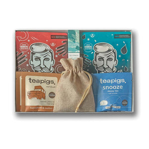 A grey gift hamper containing wellness treats 