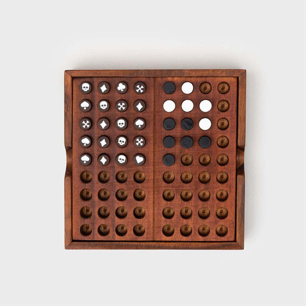 Symbol pegs and black and white pegs in a codebreaker board game