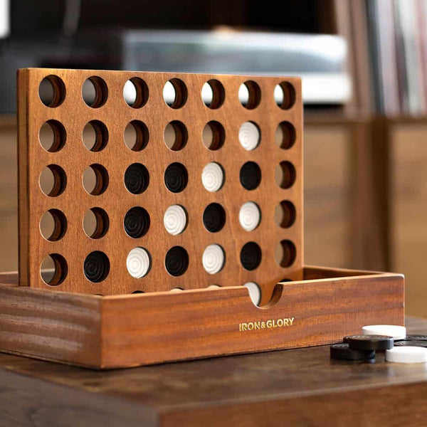 A wooden line up game set up on a table