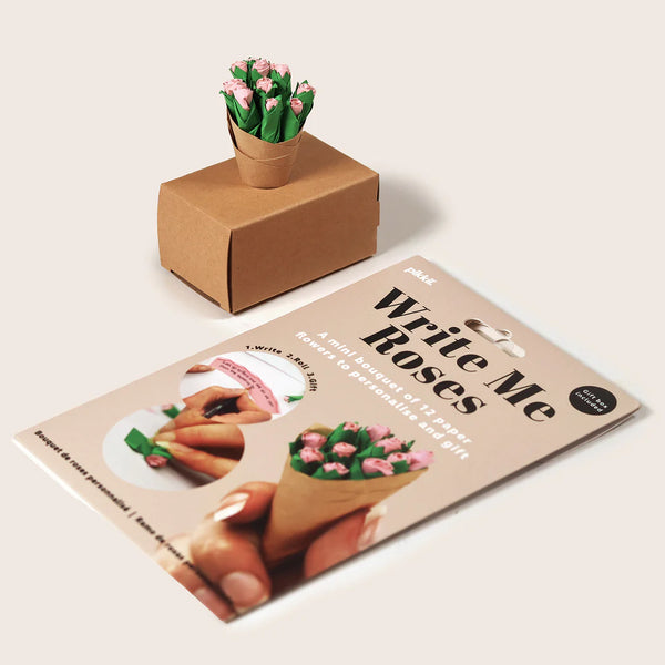 Product packaging with the words 'Write Me Roses' next to a paper roses bouquet on a beige background