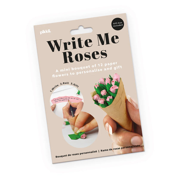 Packaging for 'Write Me Roses' craft kit with hands holding a bouquet of paper flowers