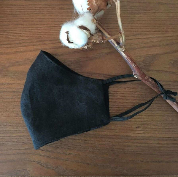 Linen Face Mask Hanging From Cotton Plant