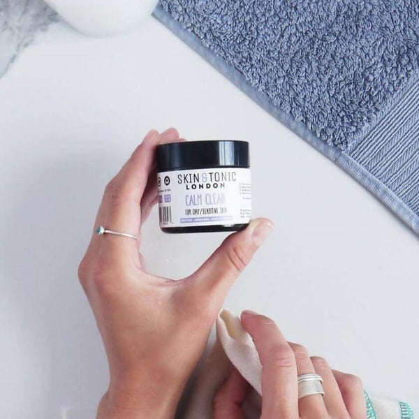 Woman holding a jar of calm clean