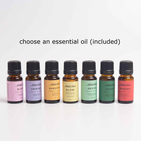 7 bottles of essential oil blends, with different coloured labels