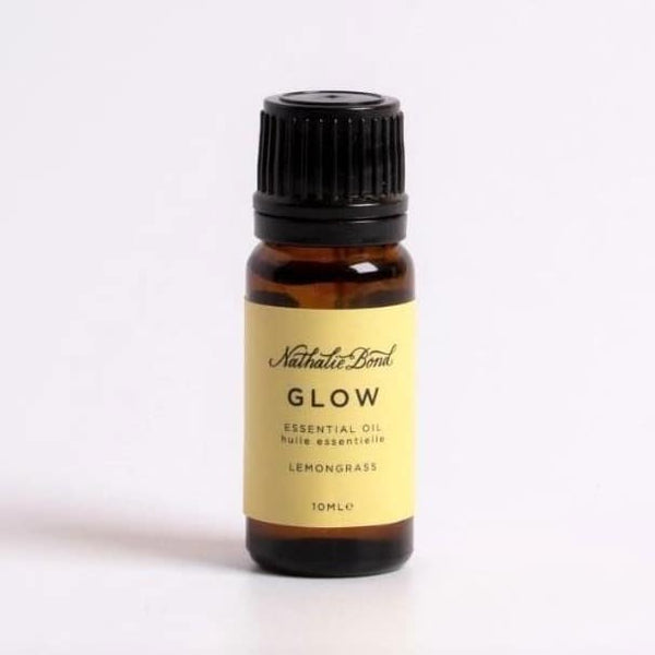 A bottle of lemongrass essential oil, on a white background